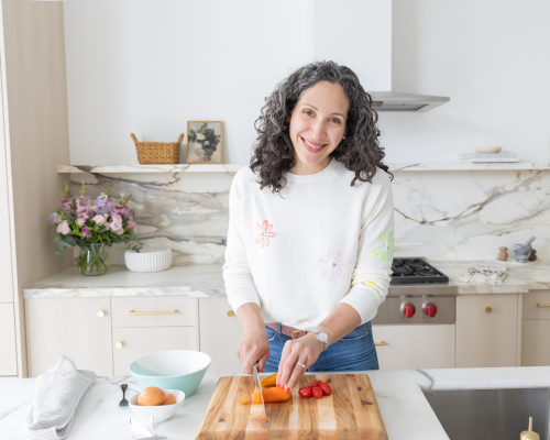 Dr Lisa chopping up vegetables